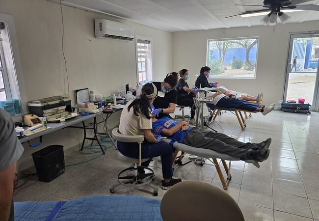 Dentists treating patients at the Medical Mission Brigade in Reynosa