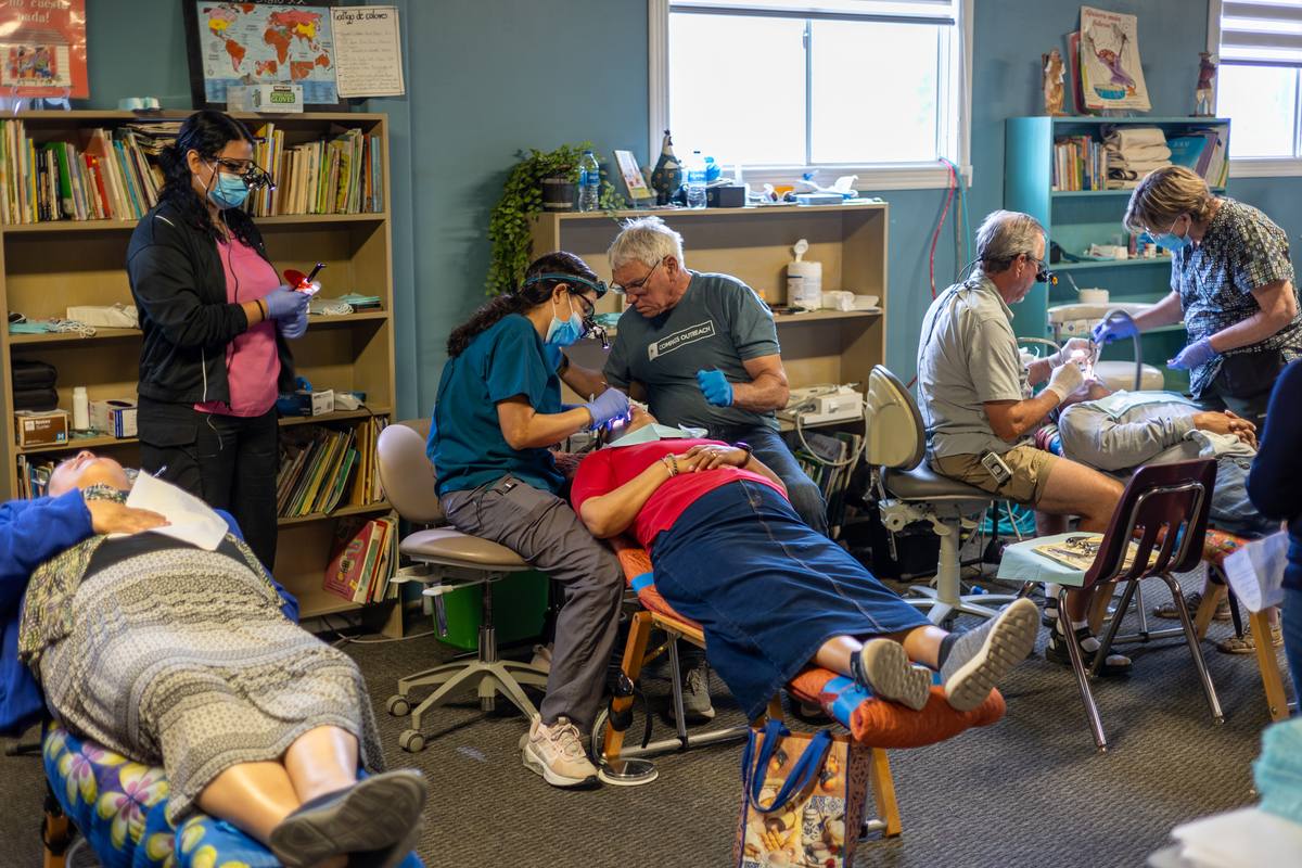Volunteer dentists treating patients during the annual Medical Mission Brigade