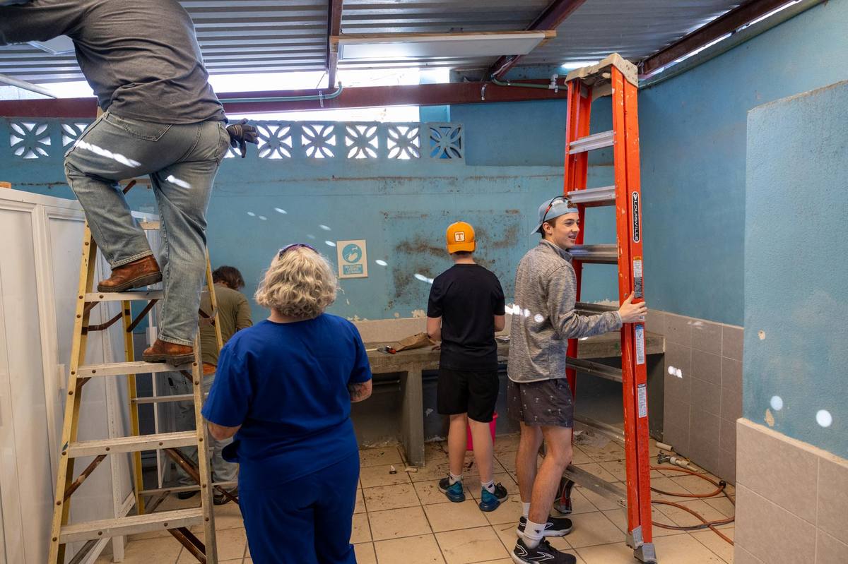 Mission team volunteers renovating a washroom at the school in Reynosa